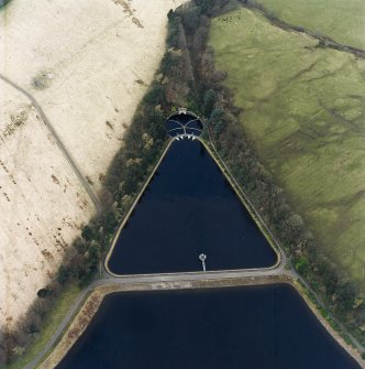 Oblique aerial view of the gauge basin and measuring pond of Craigmaddie (NS57NE 61) Reservoir