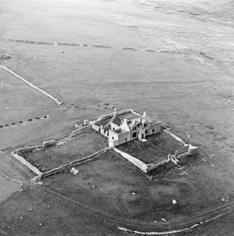 Oblique aerial view centred on the ruins of the Laird¿s House, taken from the SSE.