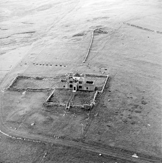 Oblique aerial view centred on the ruins of the Laird¿s House, taken from the SSW.