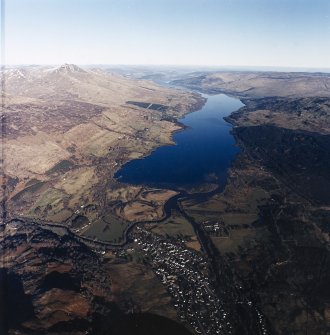 Oblique aerial view centred on Loch Tay with Killin village adjacent, taken from the SW.