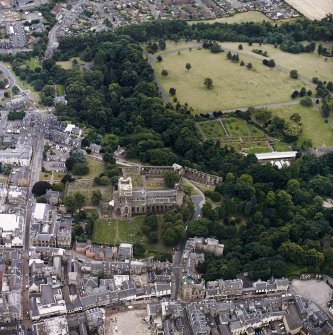 Oblique aerial view centred on the abbey, with the town hall, library and Abbots House adjacent, taken from the N.