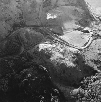 Oblique aerial view centred on the remains of the fort, taken from the NE.