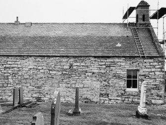 Side of church with scaffolding up at ends.