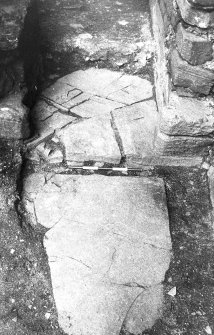 Excavation photograph : west range - room 1, step and flags of north-east door.