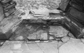Excavation photograph : west range - room 1 window excavated, from west.