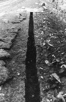 Excavation photograph : outside palace, trench after removal of paving, from south.