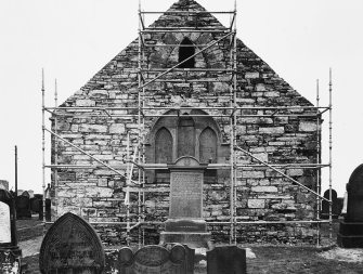 End of church (with windows) with scaffolding up.