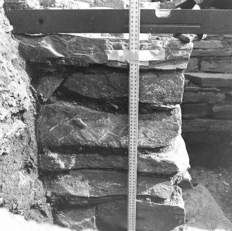 Excavation trench along base of church.