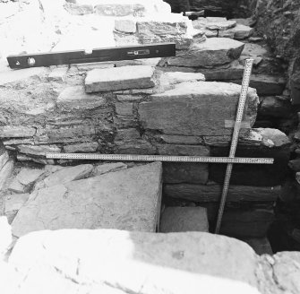 Excavation trench along base of church.