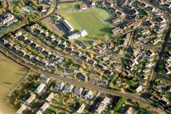 Near vertical aerial view of Stratherrick Road and Lochardil Primary School, looking NE.