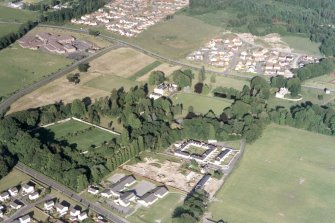 An oblique aerial view of Culloden House, Inverness, looking E.