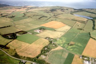 General oblique aerial view of farmland to the N of Nigg, Easter Ross, looking E.