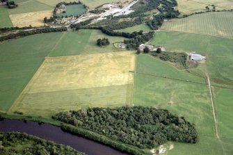 General oblique aerial view of farmland in the lower Conon valley, Ross-shire, looking ESE.