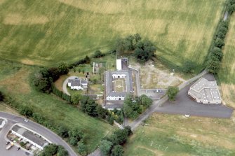 Oblique aerial view of buildings on the southern outskirts of Inverness, looking SE.