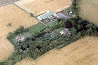Oblique aerial view of Poyntzfield House in the NE part of the Black Isle, Ross-shire, looking ESE.