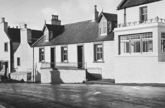 General view of nos. 75-79 Main Street, Glenluce, from SE.