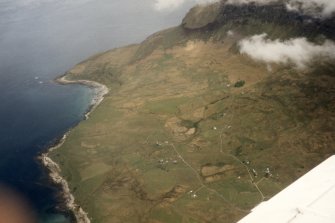 Oblique aerial view of Cleadale, Isle of Eigg, looking N. 