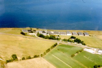 An oblique aerial view of Glenmorangie Distillery, Tain, Easter Ross, looking NE.