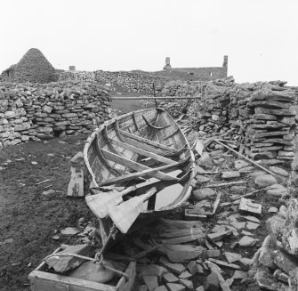 Excavation photograph : boat in between walling.