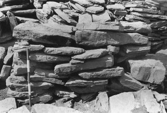 Excavation photograph : trench H - detail of south facing elevation of wall L162.

(see MS/682/120 for detailed description)