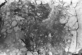Excavation photograph : trench AaX - L364 ash scatter and stone edging L365.

(see MS/682/120 for detailed description)