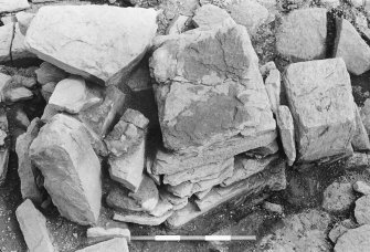 Excavation photograph : trench H - detail showing wall L371 half removed with pillar L394.

(see MS/682/120 for detailed description)