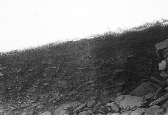 Excavation photograph : trench A - east facing, north-south section at E71.

(see MS/682/120 for detailed description)