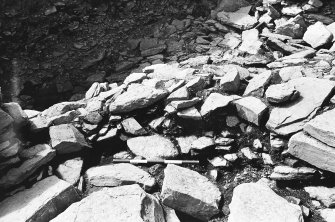 Excavation photograph : trench Aa - showing rubble L150 exposed after inner face wall L39 removed.

(see MS/682/120 for detailed description)