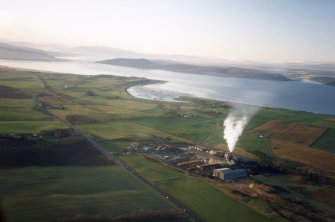 An oblique aerial view of Moray Hill, Petty, Moray Firth, looking W.