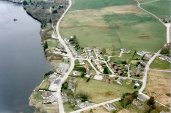 Oblique aerial view of houses on the NW side of Lairg, Sutherland, looking NW.