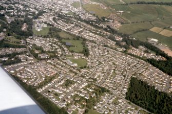 Oblique aerial view of houses in the S part of Inverness, looking E.