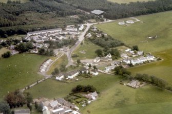 Oblique aerial view of the village of Croy near Inverness, looking S.