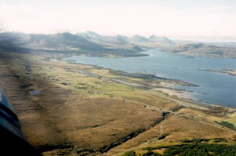 An oblique aerial view of Upper and Lower Breakish, Broadford, Isle of Skye, looking W.