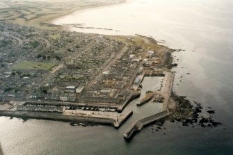 Oblique aerial view of Lossiemouth Harbour, Moray, looking W. 