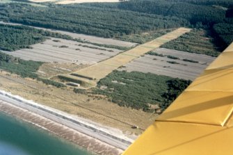 Oblique aerial view of Binn Hill Firing Range, near Kingston, Moray, looking SE.