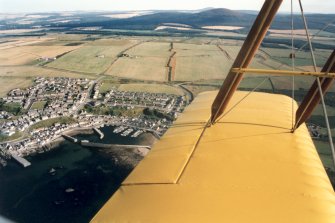 Oblique aerial view of Findochty, Moray, looking SE.