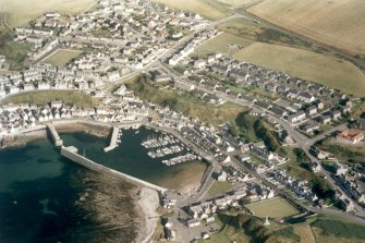 Oblique aerial view of Findochty, Moray, looking E.