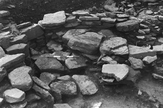 Excavation photograph : trench A(a) - L55 half removed showing L93 below.


