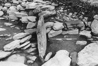 Excavation photograph : trench G - east structure, with orthostatic wall L236.

(see MS/682/120 for detailed description)