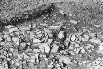 Excavation photograph : trench J - detail after removal of topsoil L1.


