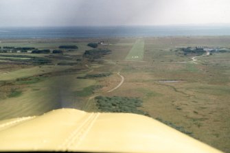 Aerial view of Dornoch Airfield, Easter Ross, looking E.