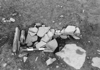 Excavation photograph :  trench R - L1891 packing beneath round house wall L1707.


