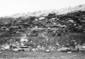 N-S section cut obliquely through broch following JCB damage. Section photographed from E (frame 13)