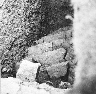 Excavation photograph: Containing wall that surrounds north east side of chamber.