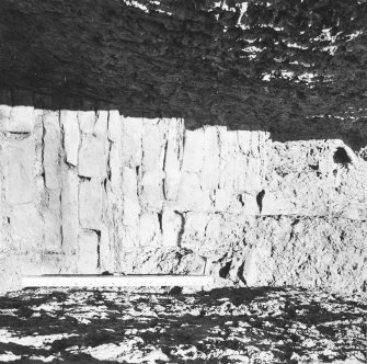 Excavation photograph: Containing wall that surrounds south east side of chamber.