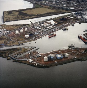 Oblique aerial view showing the docks with the oil refinery and town adjacent, Grangemouth