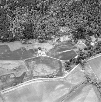 Aerial view of Castle Menzies showing tower house, well, walled garden and military road, Perthshire 