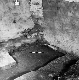 Excavation photograph. Room 2: detail of NE corner, oblique from SW.
