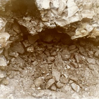 Excavation photograph showing vitrification from "outside" area OP8
