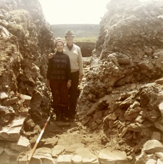 Excavation photograph showing Mr and Mrs Sheldon Fay (excavation sponsors) in entrance to dun.